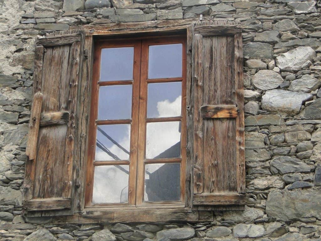 House window reflecting the sky